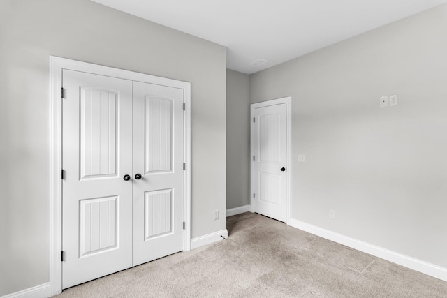 512 Pontoon Rd, Huger, SC 29450 - unfurnished bedroom with carpet, baseboards, and a closet