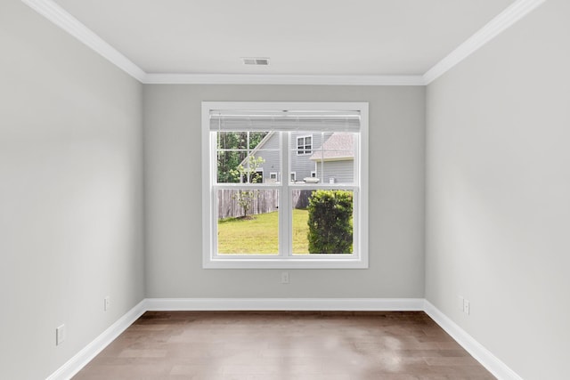 512 Pontoon Rd, Huger, SC 29450 - empty room featuring wood finished floors, crown molding, and baseboards