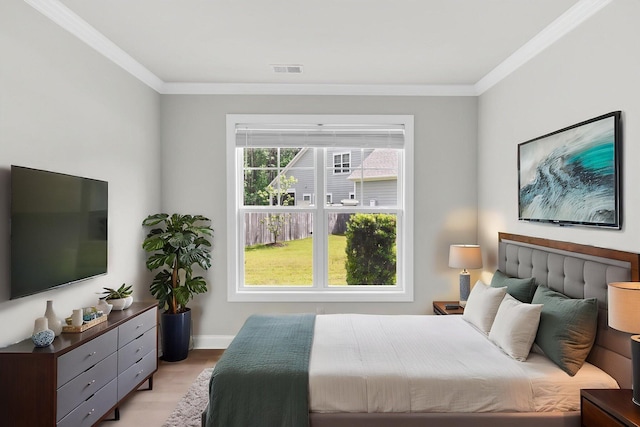 512 Pontoon Rd, Huger, SC 29450 - bedroom featuring crown molding, light wood-style flooring, and baseboards