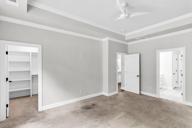 512 Pontoon Rd, Huger, SC 29450 - unfurnished bedroom featuring carpet, crown molding, a walk in closet, baseboards, and connected bathroom