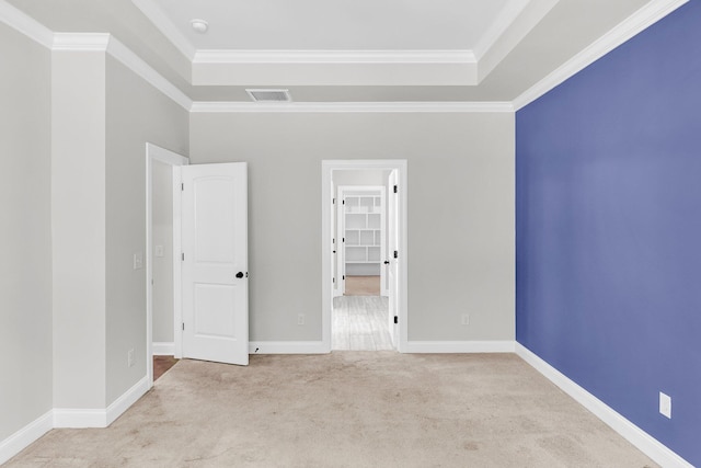512 Pontoon Rd, Huger, SC 29450 - unfurnished bedroom featuring carpet floors, a raised ceiling, ornamental molding, a walk in closet, and baseboards