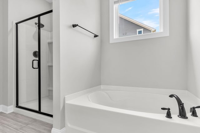 512 Pontoon Rd, Huger, SC 29450 - full bathroom with a shower stall, a garden tub, and baseboards