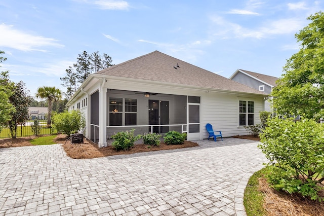 512 Pontoon Rd, Huger, SC 29450 - back of property with a sunroom, fence, ceiling fan, a shingled roof, and a patio area