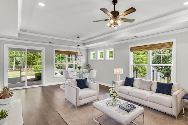 512 Pontoon Rd, Huger, SC 29450 - living room featuring a raised ceiling, wood finished floors, ceiling fan, baseboards, and crown molding