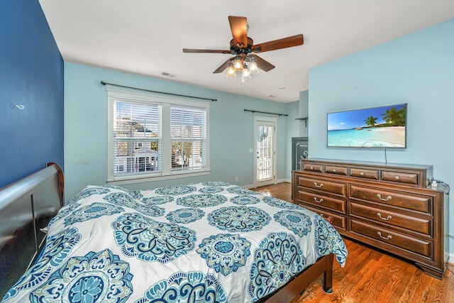 bedroom featuring dark hardwood / wood-style flooring and ceiling fan