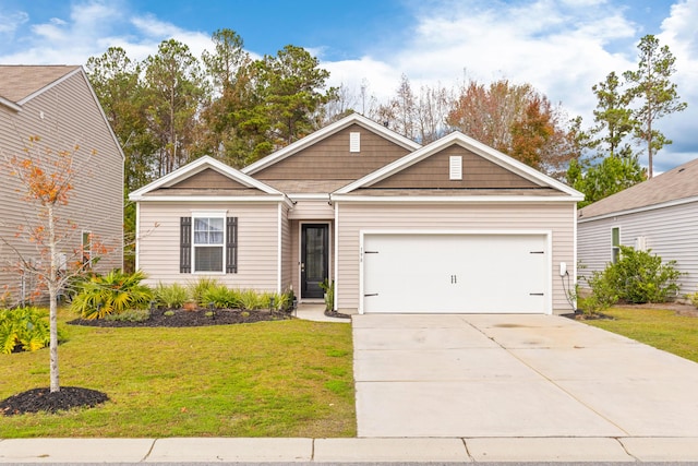 view of front of property with a garage and a front yard