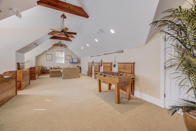 game room featuring ceiling fan, lofted ceiling with beams, and light carpet