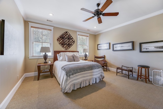 carpeted bedroom featuring ceiling fan, ornamental molding, and multiple windows