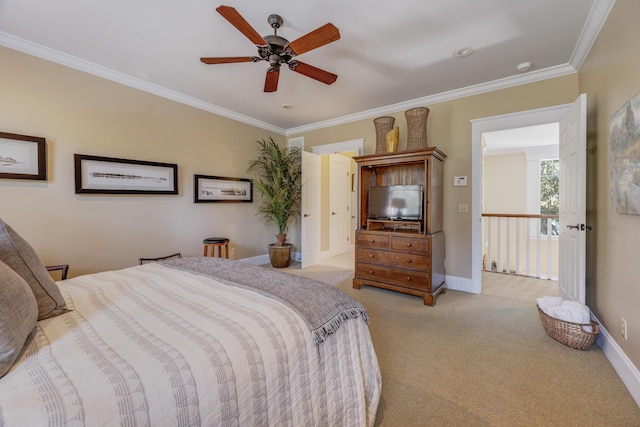 carpeted bedroom with ceiling fan and crown molding