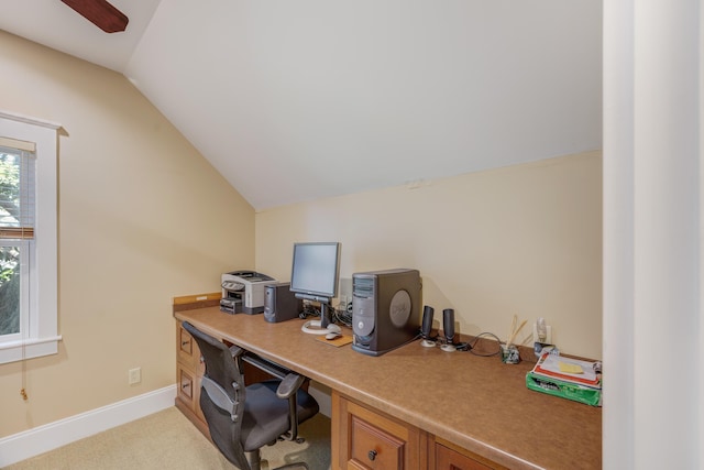 office area featuring ceiling fan, lofted ceiling, and light carpet