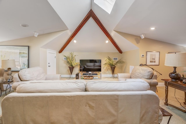 living room featuring vaulted ceiling with skylight