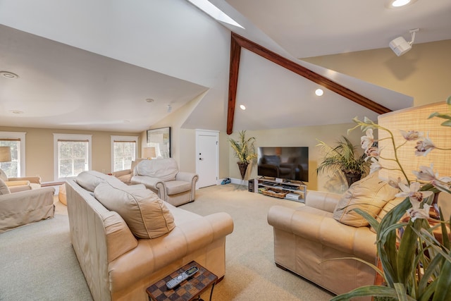 carpeted living room featuring vaulted ceiling with beams