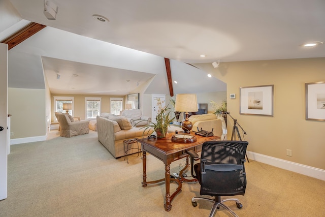 carpeted living room with lofted ceiling with beams