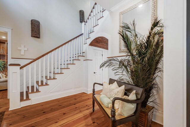 stairway with hardwood / wood-style floors