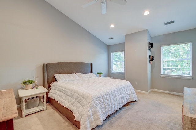 bedroom featuring baseboards, light colored carpet, recessed lighting, and visible vents