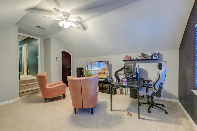 carpeted home office featuring visible vents, baseboards, ceiling fan, and vaulted ceiling