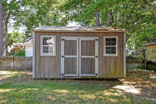 view of shed featuring a fenced backyard