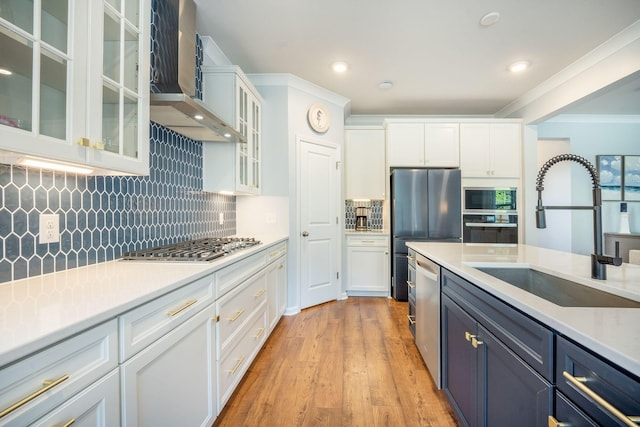 224 Wappoo Trace Ln, Summerville, SC 29486 - kitchen with a sink, appliances with stainless steel finishes, wall chimney range hood, white cabinets, and recessed lighting