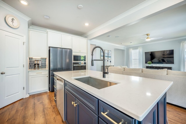 224 Wappoo Trace Ln, Summerville, SC 29486 - kitchen with a sink, stainless steel appliances, ornamental molding, open floor plan, and white cabinetry