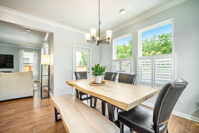 224 Wappoo Trace Ln, Summerville, SC 29486 - dining room with crown molding, a chandelier, and wood finished floors