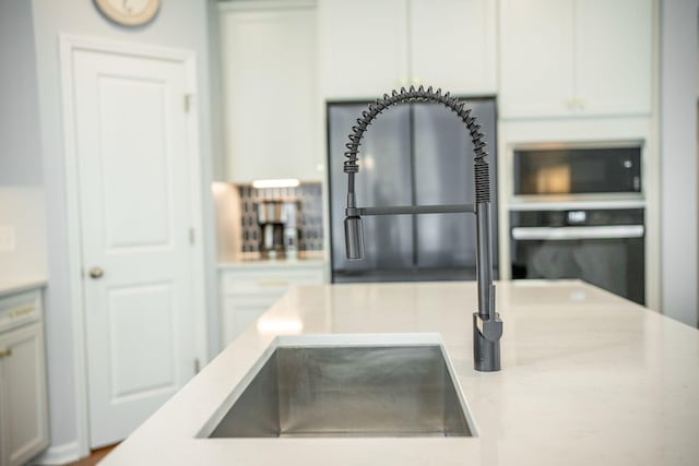 224 Wappoo Trace Ln, Summerville, SC 29486 - kitchen with oven, light stone countertops, and white cabinets