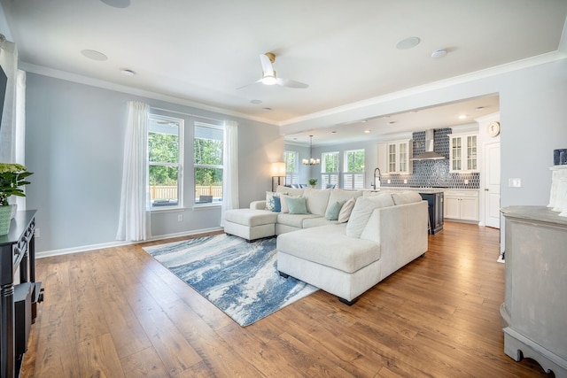 224 Wappoo Trace Ln, Summerville, SC 29486 - living area with a ceiling fan, ornamental molding, hardwood / wood-style floors, baseboards, and a chandelier
