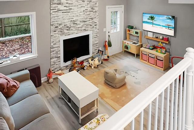 living room with a healthy amount of sunlight and hardwood / wood-style flooring