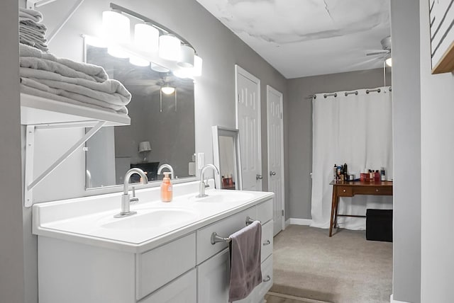 bathroom with ceiling fan and vanity