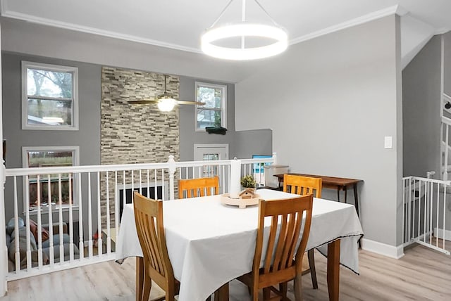 dining area with ceiling fan, hardwood / wood-style floors, and crown molding