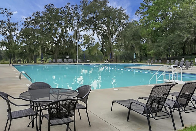 view of swimming pool with a patio area