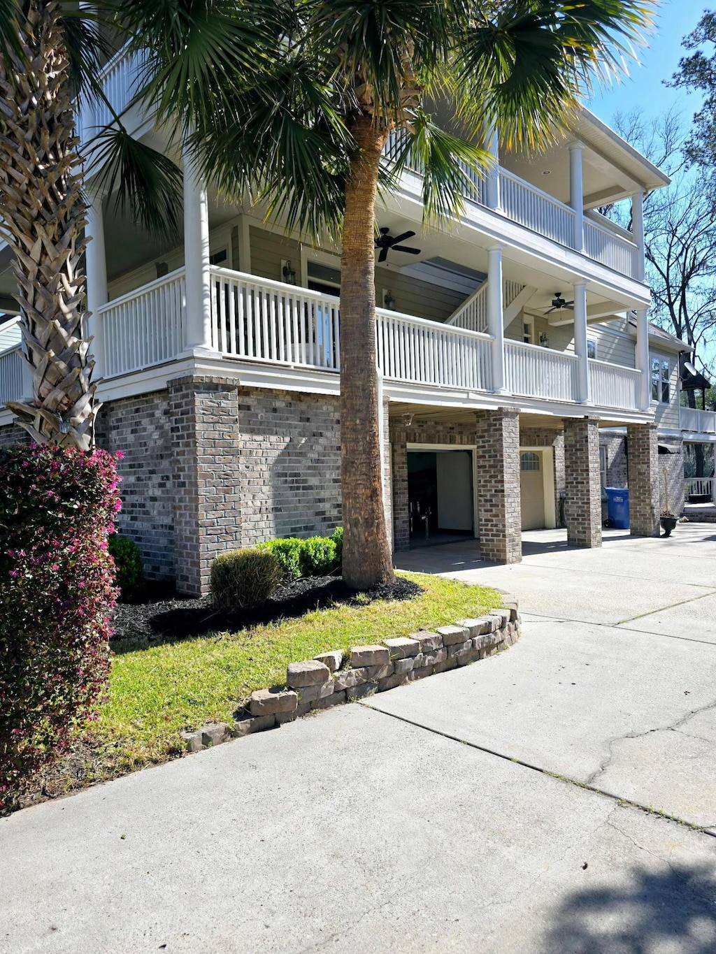 view of property with a garage and driveway