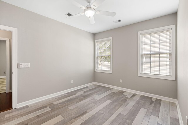 1232 Palmetto Peninsula Dr, Mount Pleasant, SC 29464 - spare room featuring a ceiling fan, baseboards, and light wood-style flooring