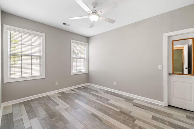 1232 Palmetto Peninsula Dr, Mount Pleasant, SC 29464 - unfurnished room with light wood-style floors, baseboards, and a ceiling fan