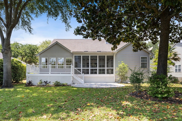 1232 Palmetto Peninsula Dr, Mount Pleasant, SC 29464 - back of property featuring a sunroom, roof with shingles, a patio, and a yard