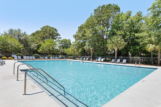 1232 Palmetto Peninsula Dr, Mount Pleasant, SC 29464 - community pool featuring fence, view of scattered trees, and a patio area