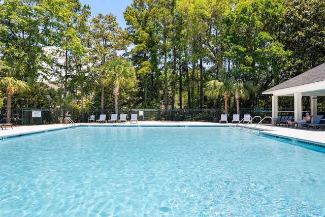 1232 Palmetto Peninsula Dr, Mount Pleasant, SC 29464 - community pool with fence and view of scattered trees