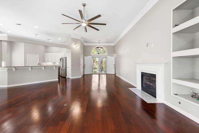 1232 Palmetto Peninsula Dr, Mount Pleasant, SC 29464 - unfurnished living room featuring a ceiling fan, a fireplace with flush hearth, ornamental molding, and dark wood finished floors