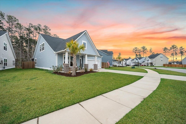 view of front of house featuring concrete driveway, board and batten siding, a front yard, a garage, and a residential view