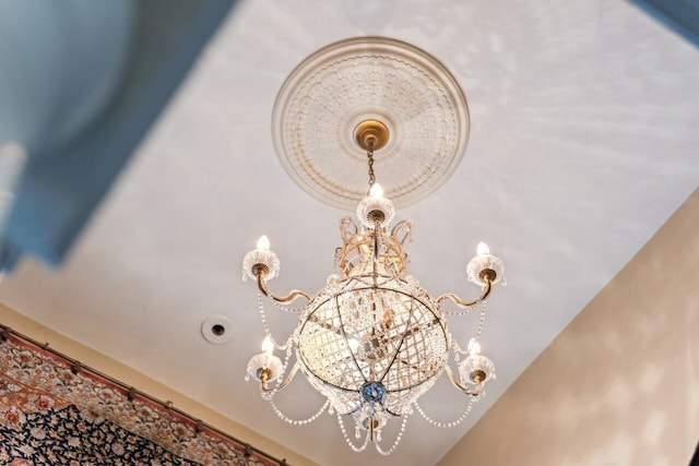 interior details featuring a notable chandelier