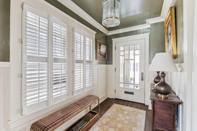 doorway to outside with dark wood-type flooring and ornamental molding