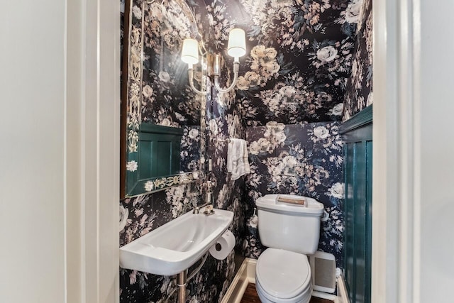 bathroom featuring sink and toilet