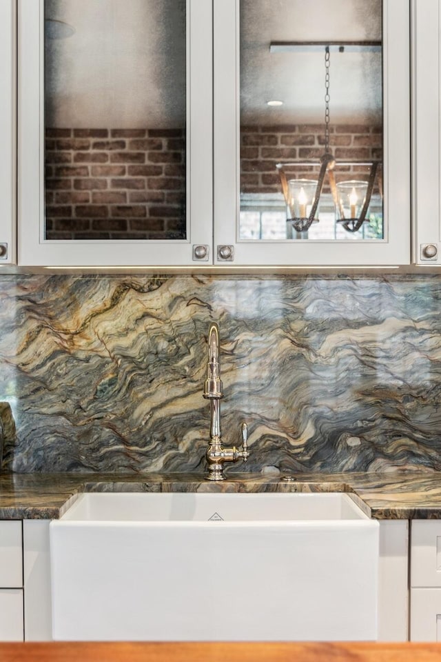 details featuring sink and backsplash