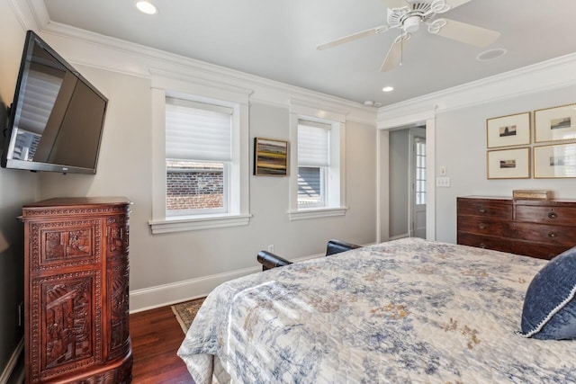 bedroom with ceiling fan, ornamental molding, and dark hardwood / wood-style floors