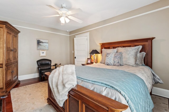 bedroom with wood-type flooring and ceiling fan