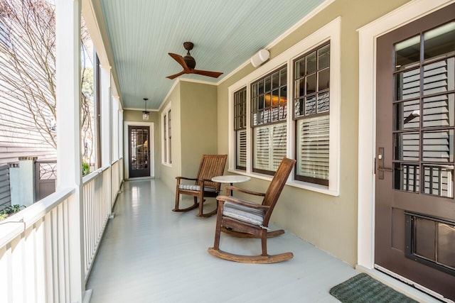 exterior space featuring ceiling fan