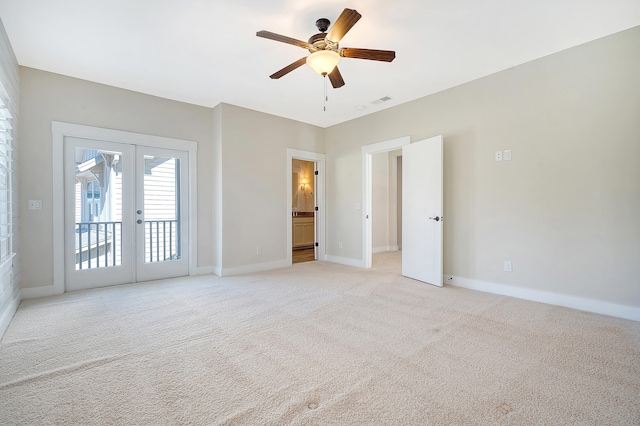 unfurnished bedroom featuring french doors, light colored carpet, visible vents, access to outside, and baseboards