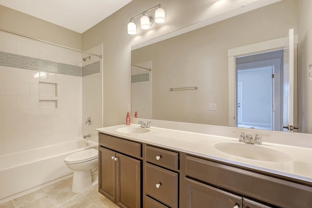 bathroom featuring shower / bathtub combination, a sink, toilet, and double vanity