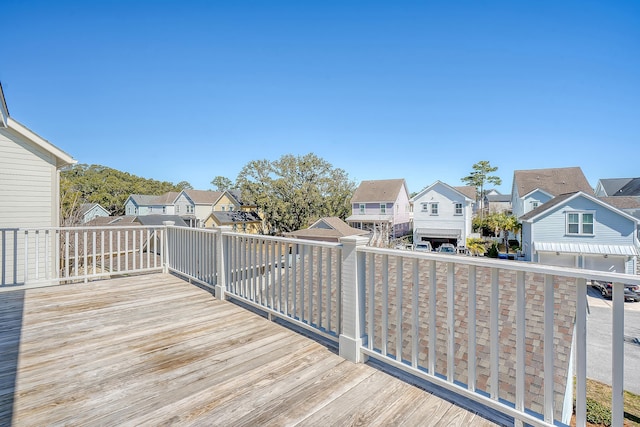 wooden deck featuring a residential view