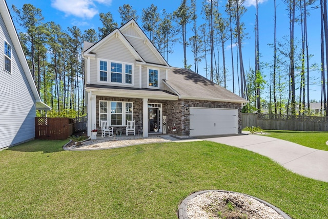 view of front of house with covered porch, an attached garage, concrete driveway, and fence