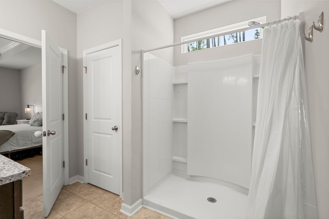 bathroom featuring tile patterned floors and a shower with shower curtain